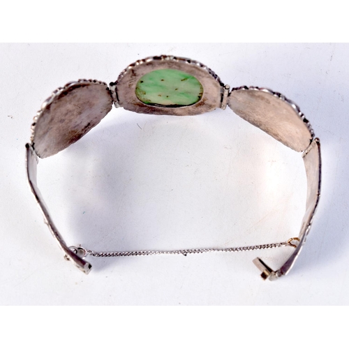 1481 - A 19TH CENTURY CHINESE SILVER AND JADE BRACELET. 37.3 grams. 6 cm wide internal width.