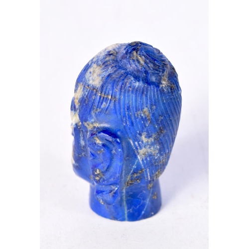 1497 - A 19TH CENTURY SOUTH EAST ASIAN CARVED LAPIS LAZULI HEAD OF A BUDDHA. 5 cm x 3 cm.