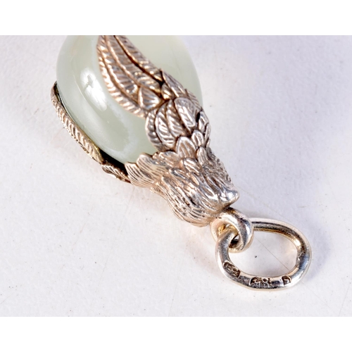 1503 - A RUSSIAN SILVER GILT AND JADE EGG PENDANT. 5.4 grams. 2.5 cm x 1.25 cm.