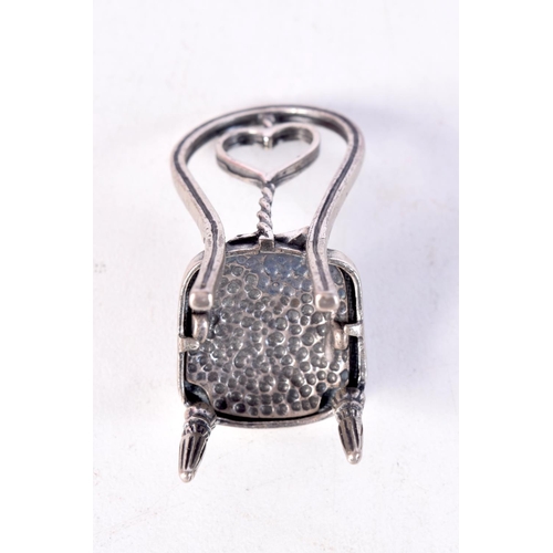 1514 - A SILVER CHAIR. 10.4 grams. 4.5 cm x 2.5 cm.