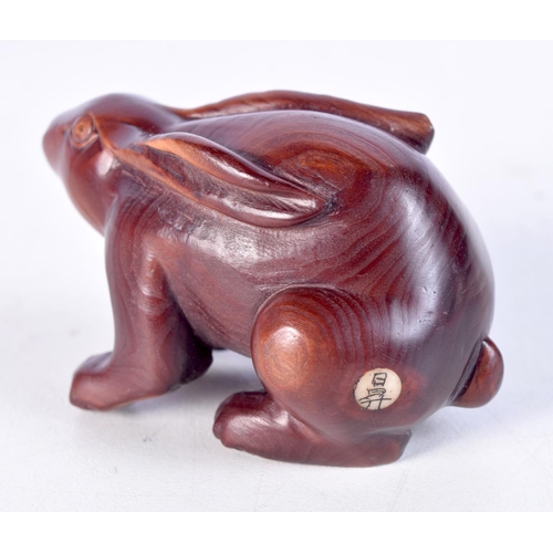 1516 - A JAPANESE CARVED WOOD RABBIT NETSUKE. 6 cm x 3.25 cm.