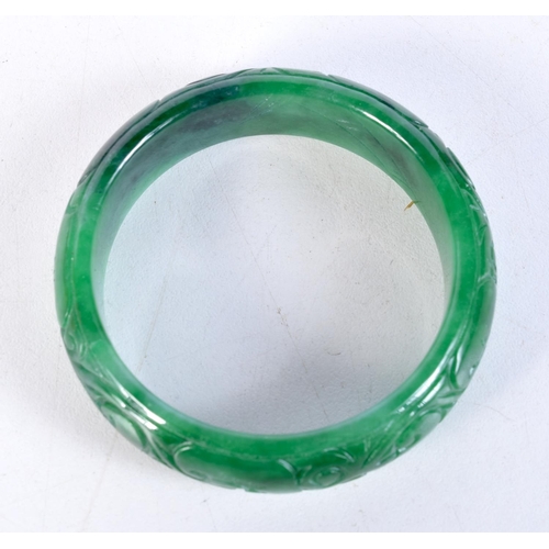 1518 - A CHINESE JADE BANGLE. 49.6 grams. 5 cm diameter.