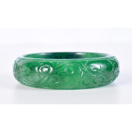 1518 - A CHINESE JADE BANGLE. 49.6 grams. 5 cm diameter.