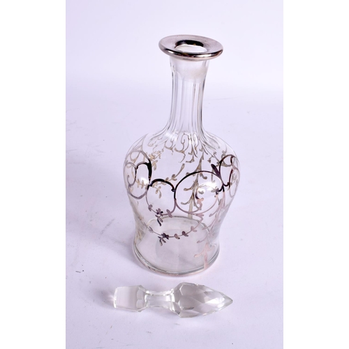 1553 - A SILVER OVERLAID GLASS DECANTER AND STOPPER. 366 grams overall. 26 cm high.