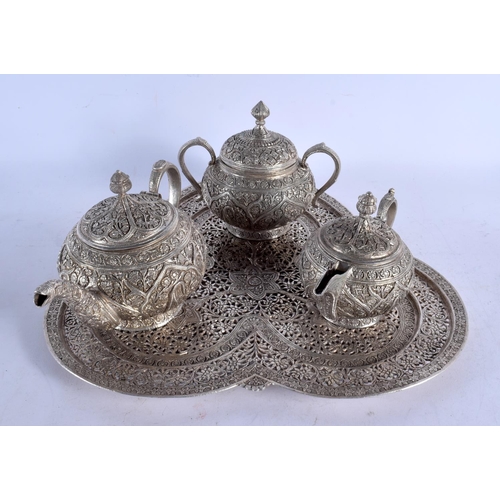 1555 - A 19TH CENTURY INDO PERSIAN SILVER TEASET WITH TRAY decorated with foliage. 2978 grams. Largest 32 c... 