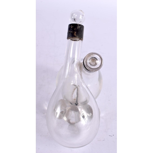 1573 - AN EDWARDIAN SILVER AND GLASS OIL AND VINEGAR BOTTLE. Birmingham 1904. 589 grams overall. 15 cm x 13... 