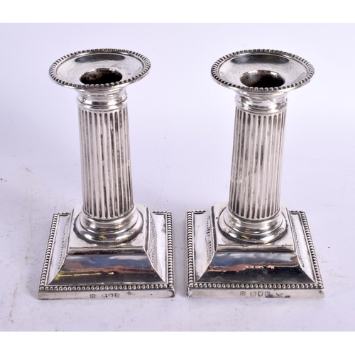 1580 - A PAIR OF VICTORIAN SILVER CANDLESTICKS. London 1892. 670 grams overall. 12.75 cm x 8 cm.