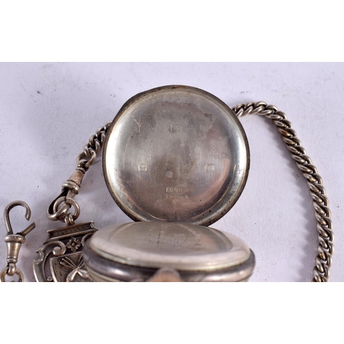 1601 - A SILVER FOB WATCH with silver chain. Birmingham 1938 & 1944. 138 grams overall. 5 cm wide.