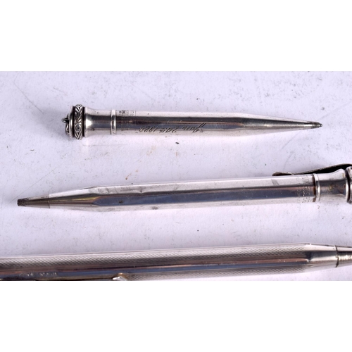 1629 - SEVEN SILVER AND WHITE METAL PROPELLING PENCILS one with a perpetual calender top. 119 grams. (7)