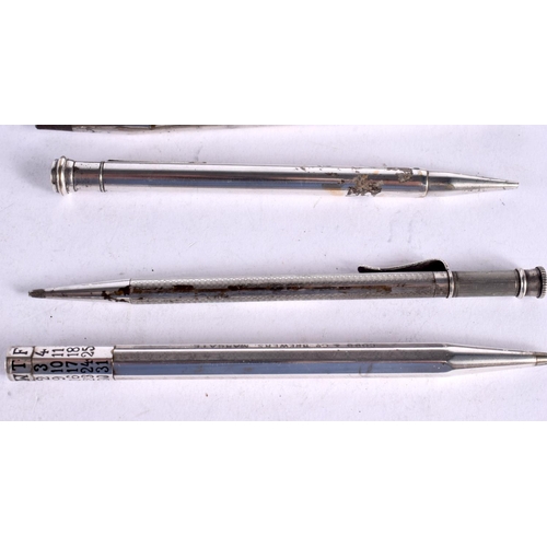 1629 - SEVEN SILVER AND WHITE METAL PROPELLING PENCILS one with a perpetual calender top. 119 grams. (7)