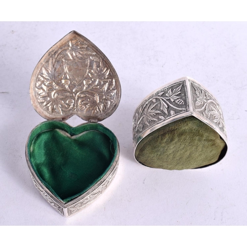 1633 - TWO INDIAN 19TH CENTURY WHITE METAL HEART SHAPED BOXES AND CUSHIONS. 166 grams overall. 7 cm x 3 cm.... 