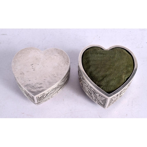 1633 - TWO INDIAN 19TH CENTURY WHITE METAL HEART SHAPED BOXES AND CUSHIONS. 166 grams overall. 7 cm x 3 cm.... 