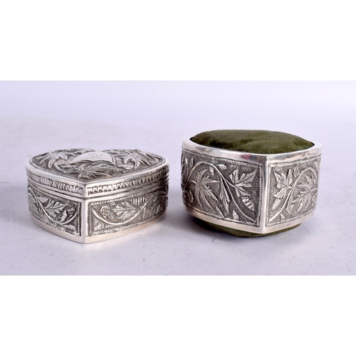 1633 - TWO INDIAN 19TH CENTURY WHITE METAL HEART SHAPED BOXES AND CUSHIONS. 166 grams overall. 7 cm x 3 cm.... 