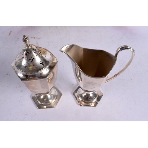 1639 - A CASED SILVER SIFTER AND JUG. Chester 1912. 294 grams. 16 cm x 6.5 cm.