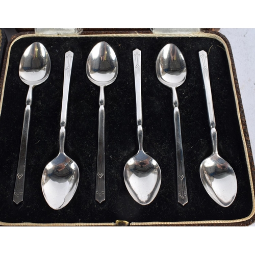 1646 - A CASED SET OF ART DECO PISTOL GRIP SILVER KNIVES together with a set of silver spoons. Sheffield 19... 