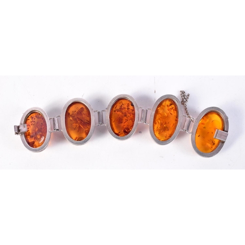 1664 - A SILVER AND AMBER BRACELET. 98 grams. 19 cm x 5 cm.