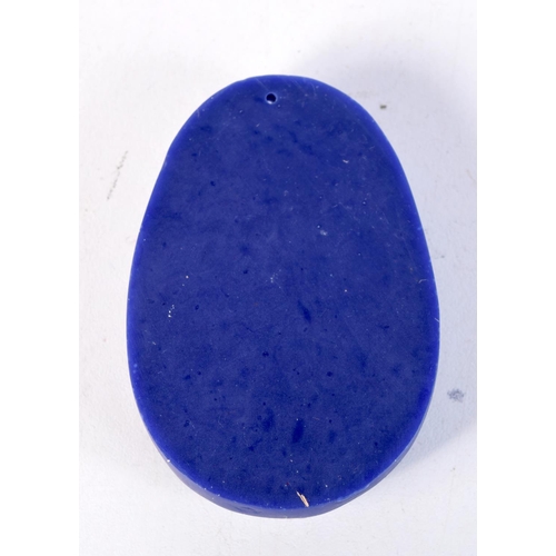 1672 - A CHINESE CARVED LAPIS TYPE PENDANT. 60.8 grams. 7 cm x 5 cm.