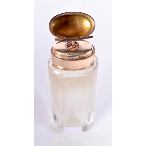 1674 - AN 18CT GOLD CRYSTAL GLASS SCENT BOTTLE. 45.8 grams overall. 9 cm x 2.5 cm.