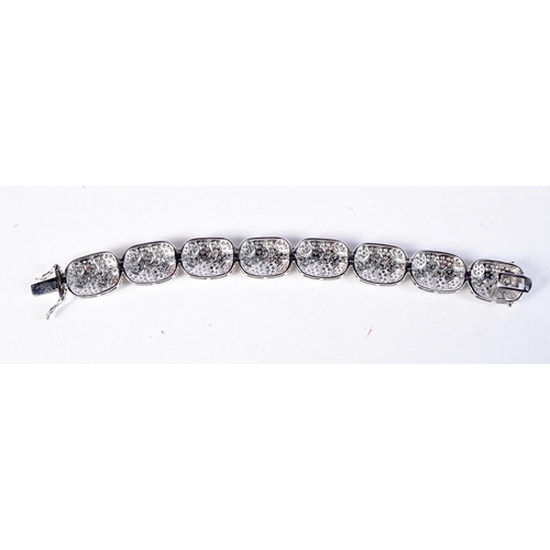 1695 - A SILVER CZ BRACELET. 38 grams. 20 cm long.