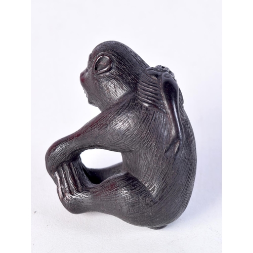 1702 - A JAPANESE BOXWOOD MONKEY NETSUKE. 4.5 cm x 3.5 cm.