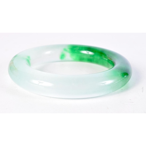 1715 - A CHINESE CARVED JADE BANGLE. 97 grams. 6 cm diameter.