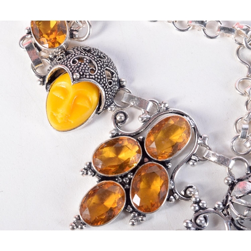 1729 - A SILVER AND AMBER NECKLACE. 82 grams. 52 cm long.