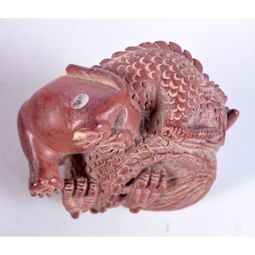 1749 - A JAPANESE BOXWOOD DRAGON NETSUKE. 38.2 grams. 6 cm x 5 cm.