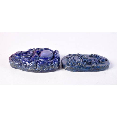 1753 - TWO CHINESE CARVED LAPIS LAZULI TYPE PENDANTS. 65.6 grams. 5 cm x 4 cm. (2)