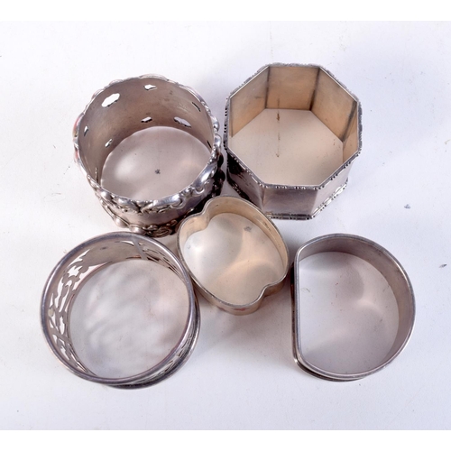 1778 - FIVE SILVER NAPKIN RINGS. Birmingham 1921 to 1934. 114 grams. Largest 4.75 cm x 3.5 cm. (5)