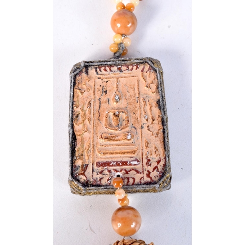 1787 - A THAI PENDANT. 40 cm long, pendant 7 cm x 5 cm.