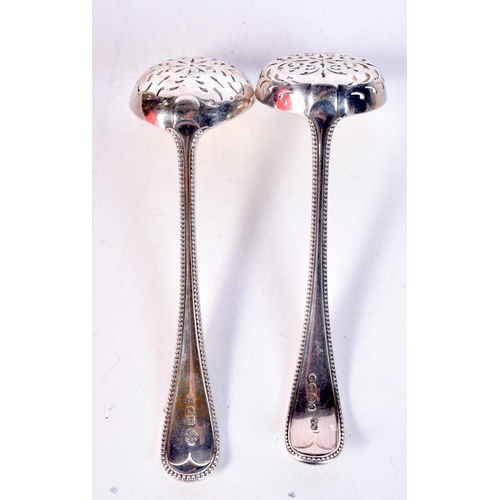 1803 - TWO SILVER SIFTING SPOONS. London 1860 & 1902. 115 grams. 15 cm x 4.5 cm. (2)