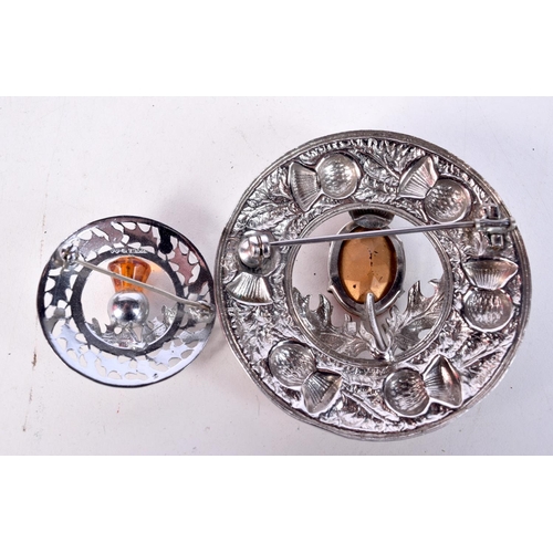 1805 - TWO SCOTTISH WHITE METAL BROOCHES. 42.5 grams. Largest 7 cm diameter. (2)