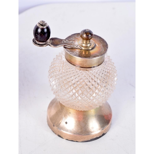 1848 - AN ART DECO SILVER SUGAR SIFTER together with a silver and cut glass pepperette & a silver mounted m... 