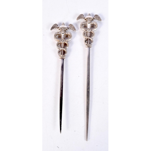 1852 - A PAIR OF UNUSUAL ANTIQUE WHITE METAL MILITARY SERPENT SKEWERS. 51 grams. 15.5 cm x 3.5 cm.