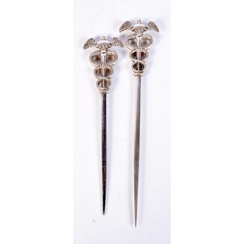 1852 - A PAIR OF UNUSUAL ANTIQUE WHITE METAL MILITARY SERPENT SKEWERS. 51 grams. 15.5 cm x 3.5 cm.