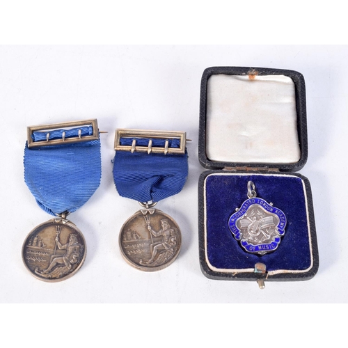 1856 - A PAIR OF HMS WORCESTER & CONWAY SILVER BOAT RACE MEDALS together with a silver and enamel medallion... 