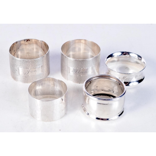 1857 - SILVER NAPKIN RINGS. Birmingham 1919 to 1942. 123 grams. Largest 4.5 cm x 3 cm. (qty)