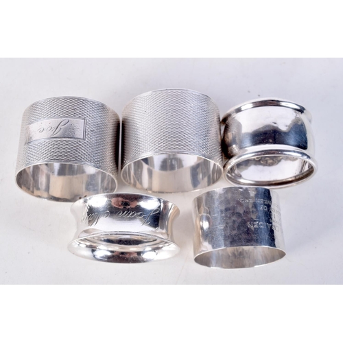 1857 - SILVER NAPKIN RINGS. Birmingham 1919 to 1942. 123 grams. Largest 4.5 cm x 3 cm. (qty)