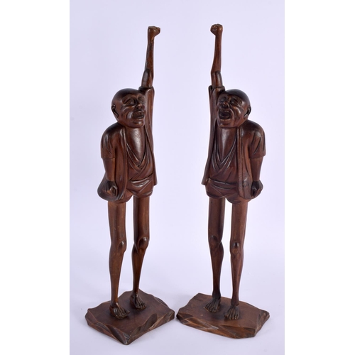 2004 - A LARGE PAIR OF 19TH CENTURY JAPANESE MEIJI PERIOD CARVED WOOD OKIMONO modelled as males with elonga... 