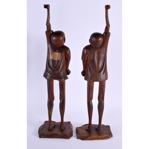 2004 - A LARGE PAIR OF 19TH CENTURY JAPANESE MEIJI PERIOD CARVED WOOD OKIMONO modelled as males with elonga... 