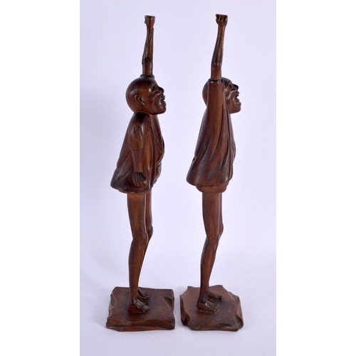 2004 - A LARGE PAIR OF 19TH CENTURY JAPANESE MEIJI PERIOD CARVED WOOD OKIMONO modelled as males with elonga... 