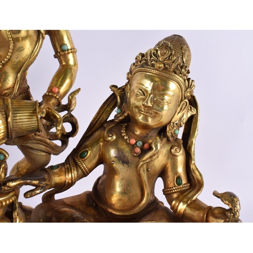 2010 - A LARGE CHINESE TIBETAN BRONZE FIGURE OF TWO BUDDHAS 20th Century, modelled upon a lotus capped base... 