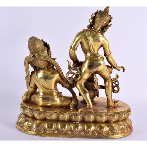 2010 - A LARGE CHINESE TIBETAN BRONZE FIGURE OF TWO BUDDHAS 20th Century, modelled upon a lotus capped base... 