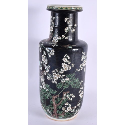 2021 - A LARGE 19TH CENTURY CHINESE FAMILLE NOIRE PORCELAIN ROULEAU VASE Kangxi style, painted with foliage... 