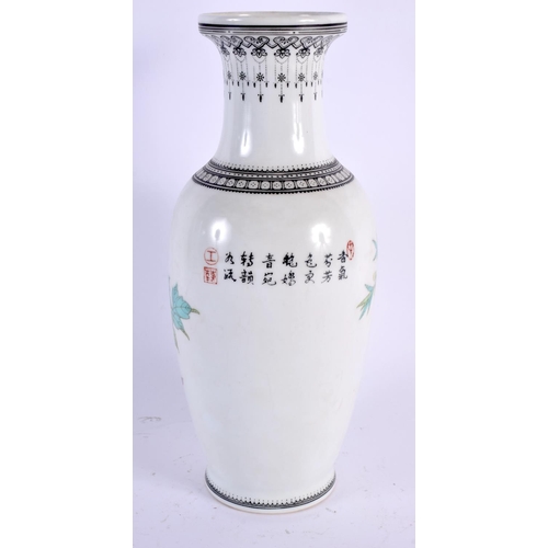 2024 - A CHINESE REPUBLICAN PERIOD FAMILLE ROSE PORCELAIN VASE painted with birds and foliage. 26 cm high.