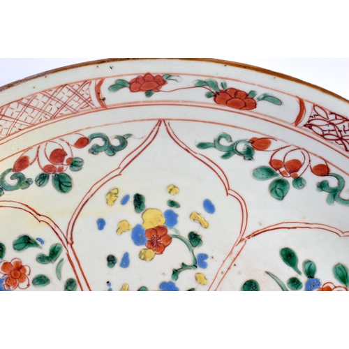 2029 - A LARGE 17TH/18TH CENTURY CHINESE FAMILLE VERTE DISH Kangxi style, painted with flowers within Islam... 