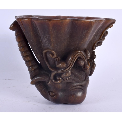 2032 - A CHINESE CARVED BUFFALO HORN TYPE LIBATION CUP 20th Century. 426 grams. 10 cm x 12 cm.