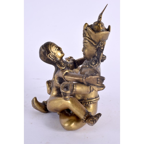 2059 - AN 18TH/19TH CENTURY INDIAN TIBETAN BRONZE BUDDHISTIC FIGURE of erotic form. 14 cm x 8 cm.