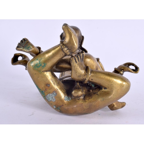 2059 - AN 18TH/19TH CENTURY INDIAN TIBETAN BRONZE BUDDHISTIC FIGURE of erotic form. 14 cm x 8 cm.