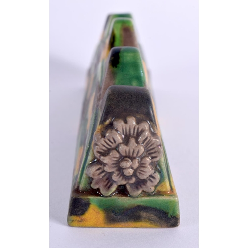 2079 - A CHINESE SANCAI GLAZED POTTERY BRUSH REST 20th Century. 13 cm wide.